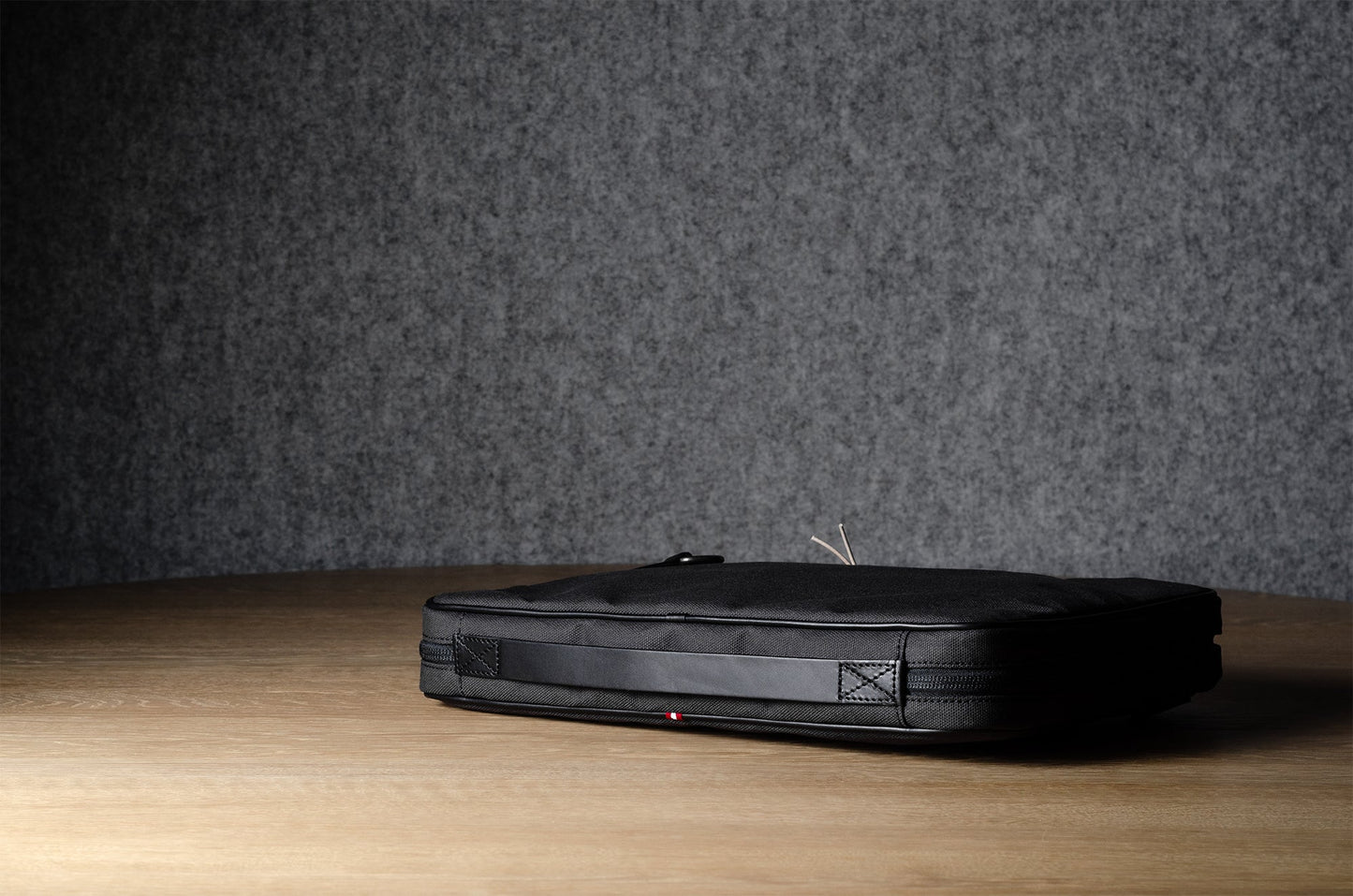 A suitable laptop bag. Charcoal gray.