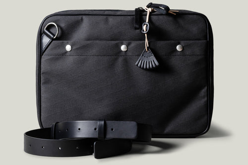 A suitable laptop bag. Charcoal gray.