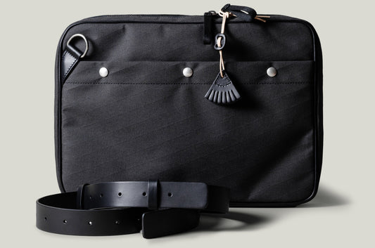 A suitable laptop bag. Charcoal gray.