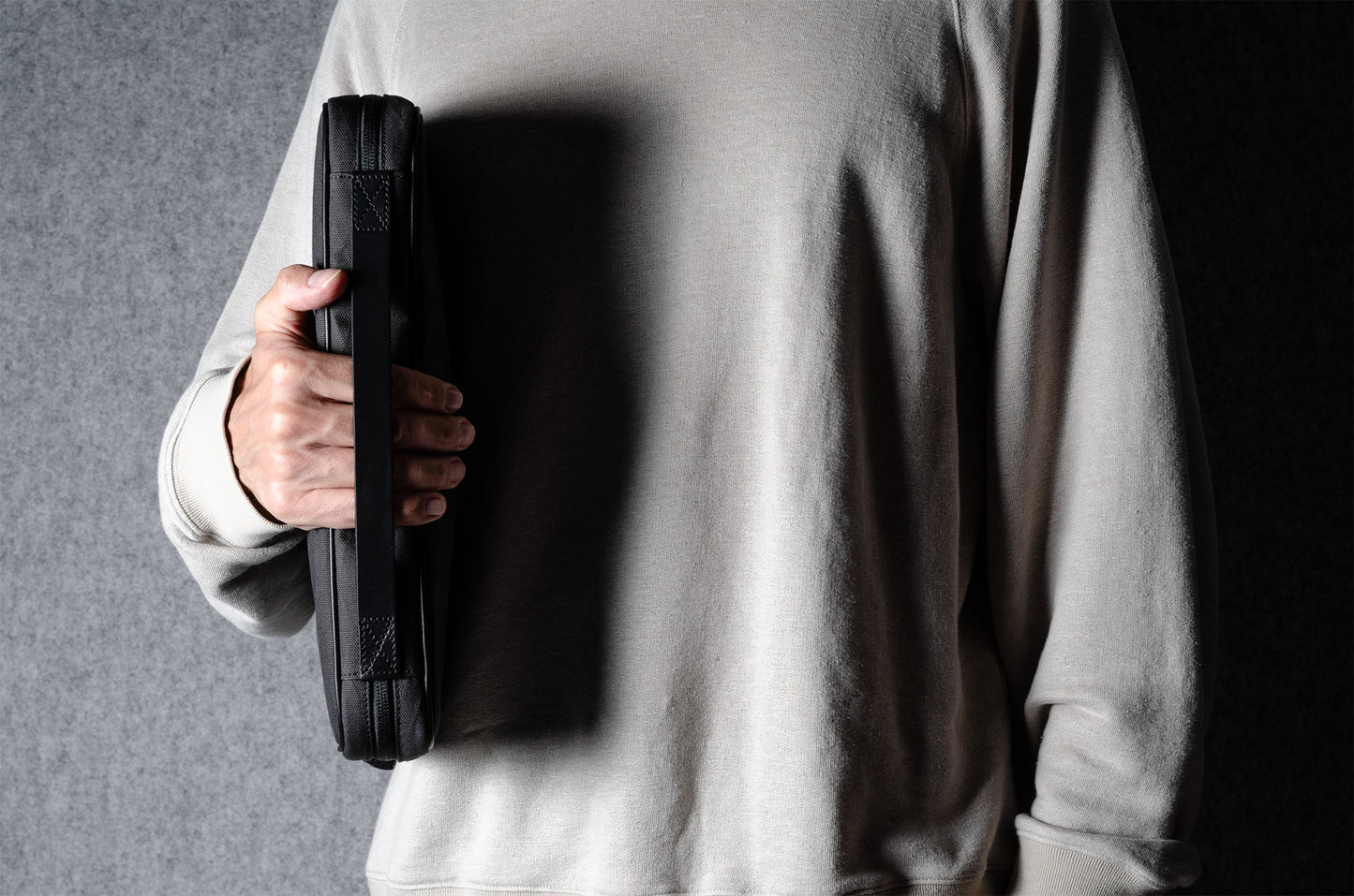 A suitable laptop bag. Charcoal gray.
