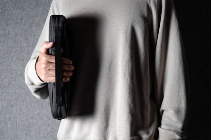 A suitable laptop bag. Charcoal gray.