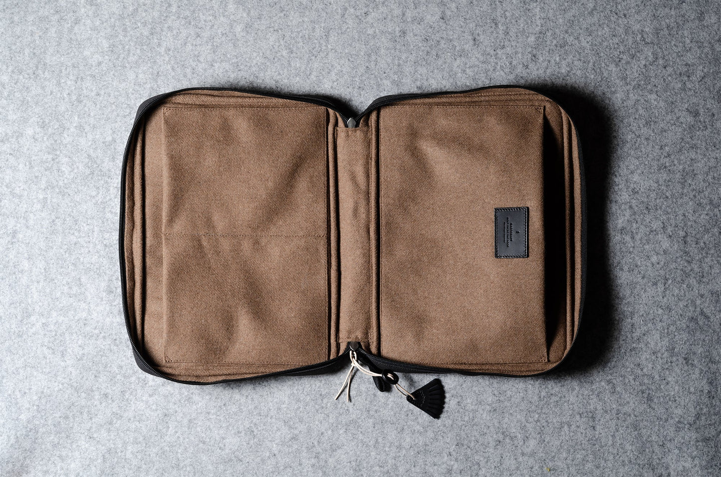 A suitable laptop bag. Charcoal gray.