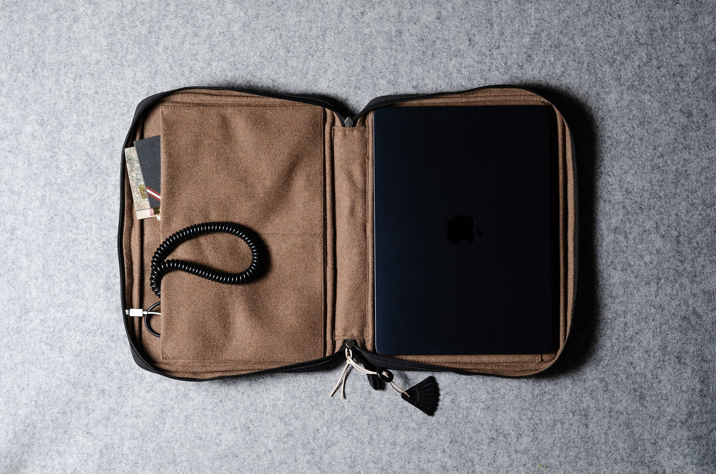 A suitable laptop bag. Charcoal gray.