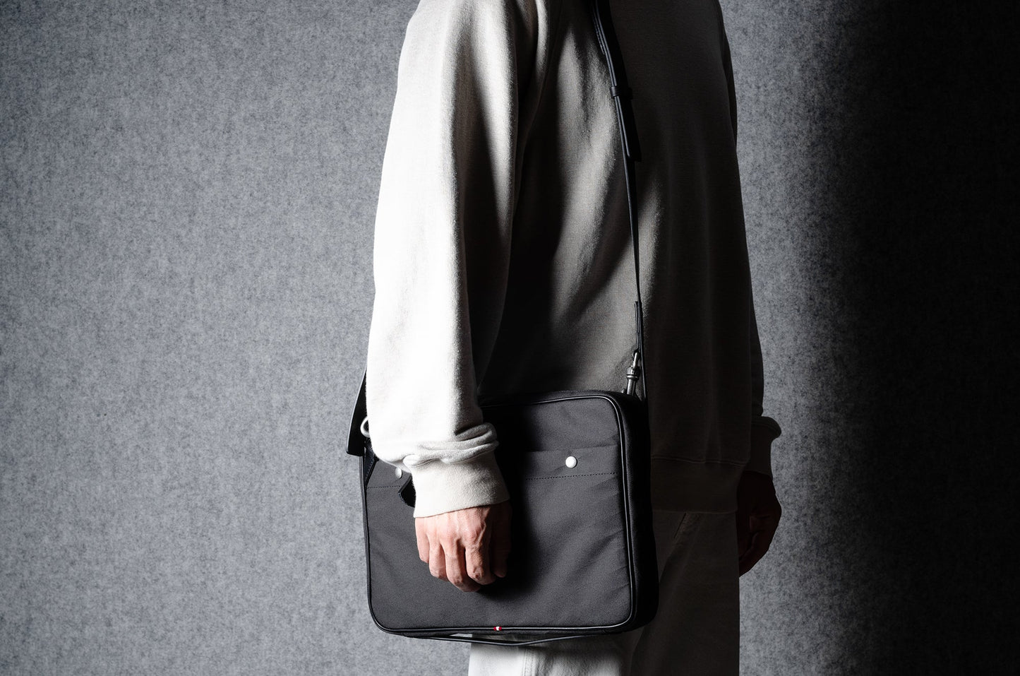 A suitable laptop bag. Charcoal gray.
