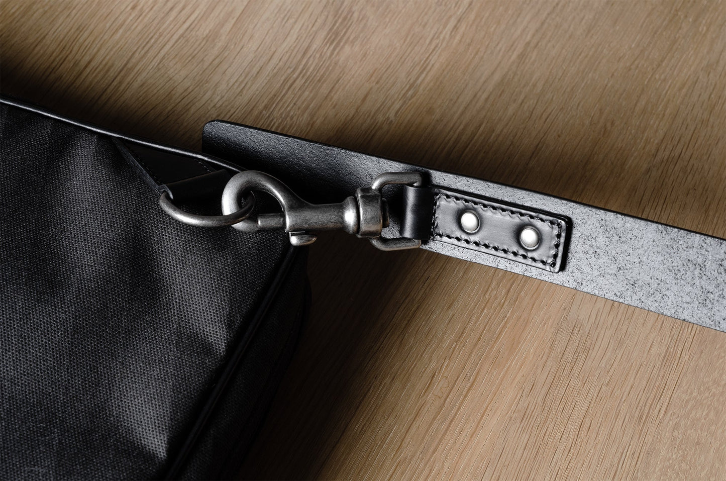 A suitable laptop bag. Charcoal gray.