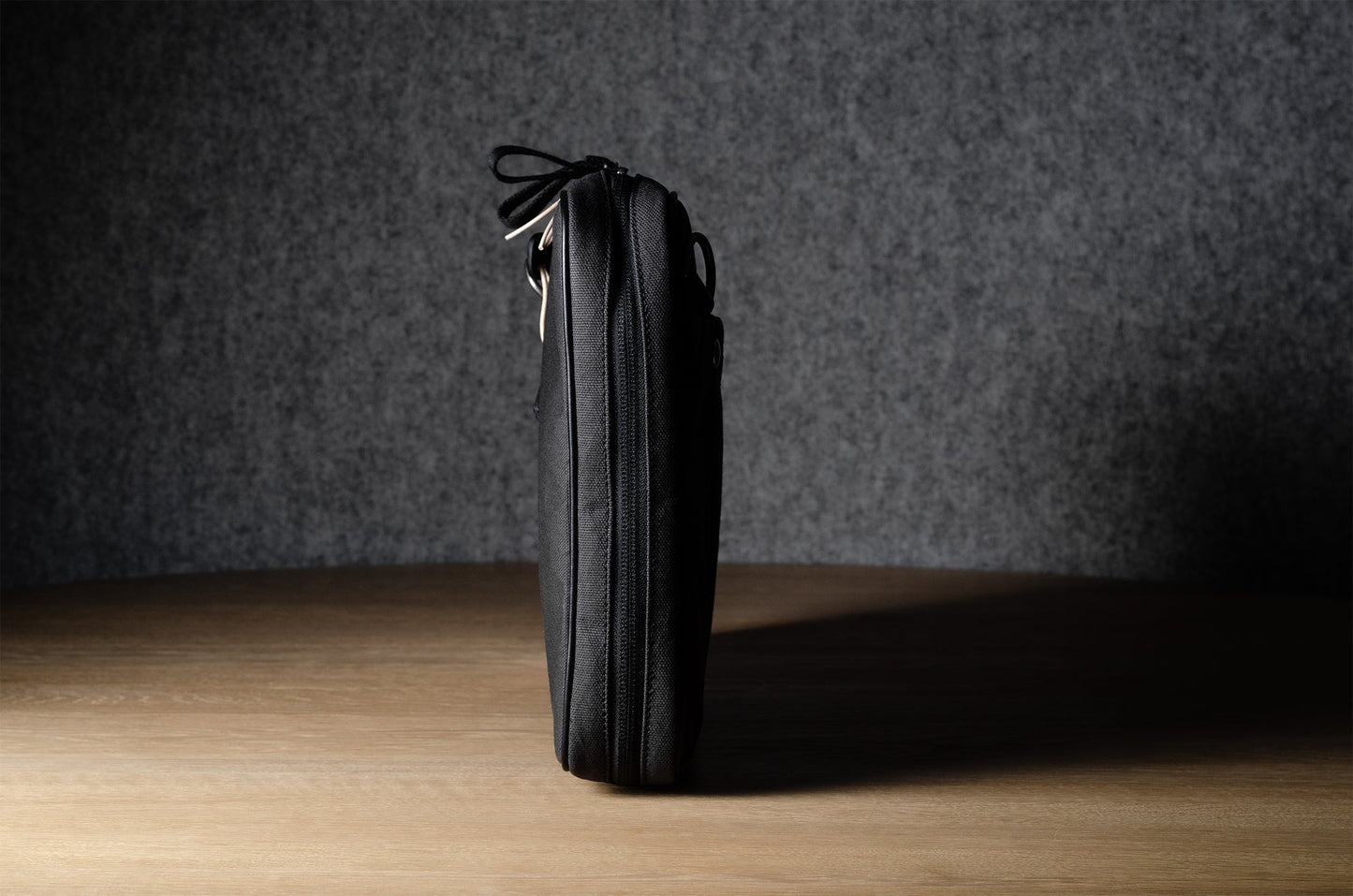 A suitable laptop bag. Charcoal gray.