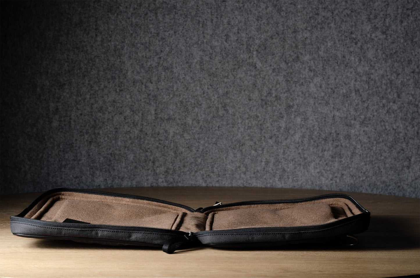 A suitable laptop bag. Charcoal gray.