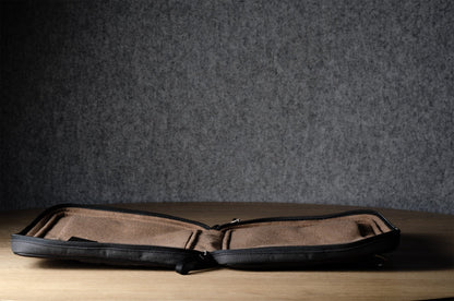 A suitable laptop bag. Charcoal gray.