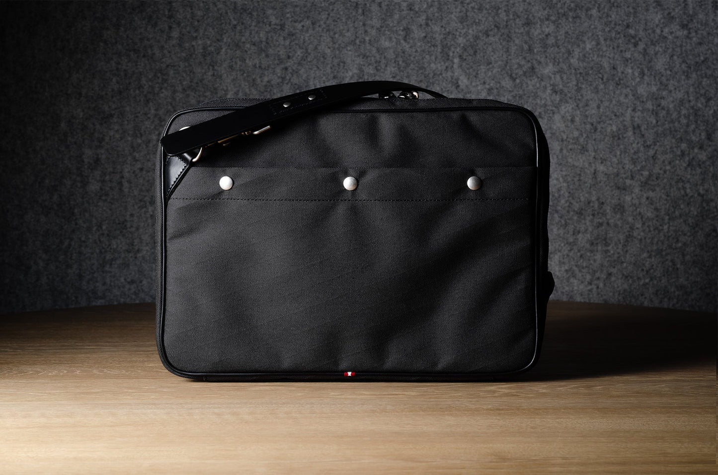 A suitable laptop bag. Charcoal gray.