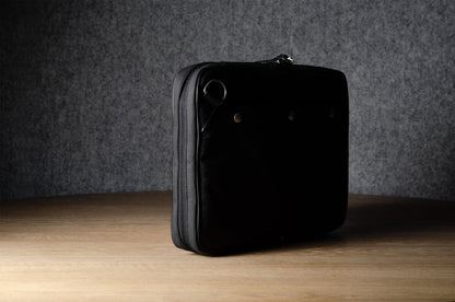 A suitable laptop bag. Charcoal gray.