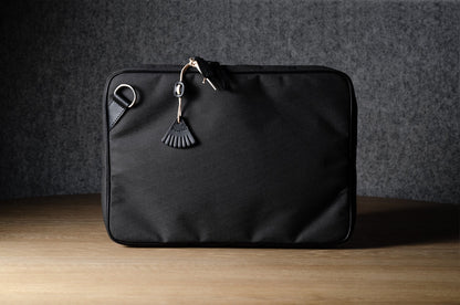 A suitable laptop bag. Charcoal gray.